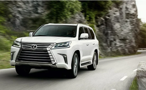 White 2022 Lexus LX driving on a road in Englewood, NJ